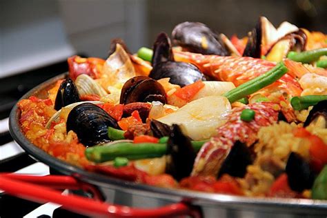 It's so colorful with a tossed salad and garlic bread — and always gets raves! How To Cook A Wolf: Christmas Eve Paella....