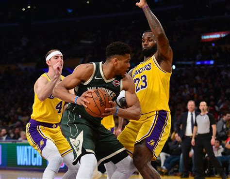 Alex caruso plays as guard for in the nba. Alex Caruso, Giannis Antetokounmpo and LeBron James