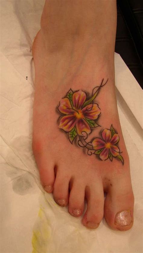 25 Amazing Flower Tattoos On Foot For Girls