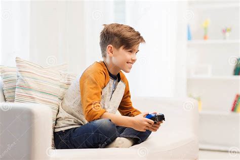 Happy Boy With Joystick Playing Video Game At Home Stock Image Image