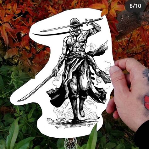 A Hand Holding Up A Sticker With A Drawing Of A Samurai On It
