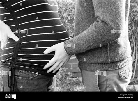 Pregnant And Hands Touching Stomach Black And White Stock Photos Images Alamy