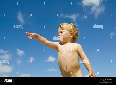 Portrait Of Little Boy Pointing Direction Stock Photo Alamy