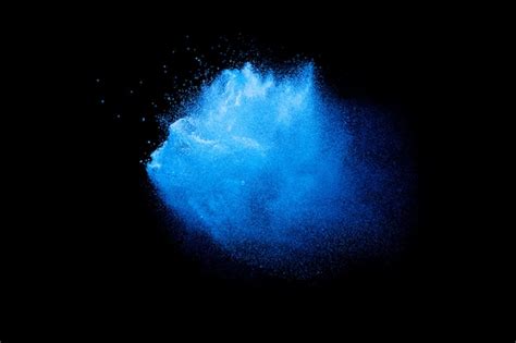 Premium Photo Blue Powder Explosion In The Dark