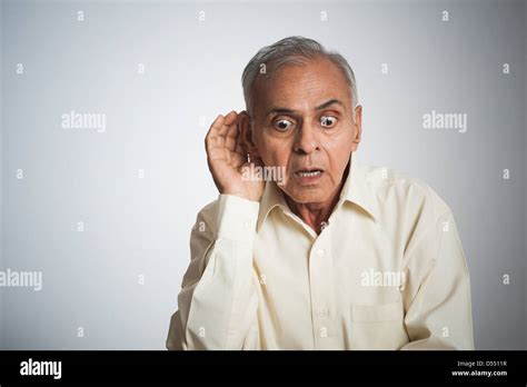 Man Cupping Hand To Ear Stock Photo Alamy