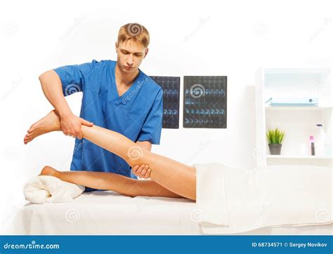 Masseur Doing Exercises With Woman Leg Stock Image Image Of Recover