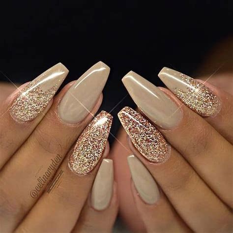 White nails with gold and silver glitter on a background of the christmas tree. 50 Fabulous Ways to Wear Glitter Nails Like a Boss