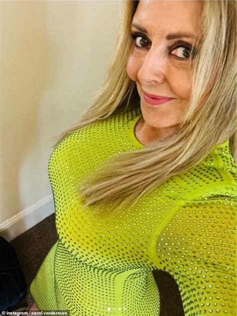 Carol Vorderman Shows Off Her Curves In A Sparkling Green Dress As She