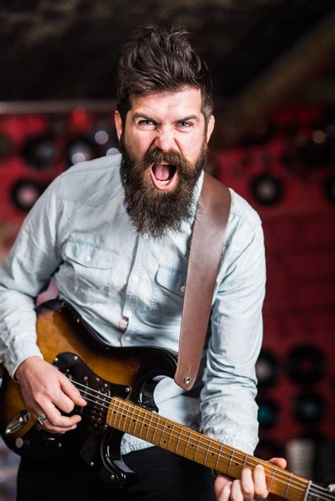 Rock Music Concept Musician With Beard Play Electric Guitar Talented