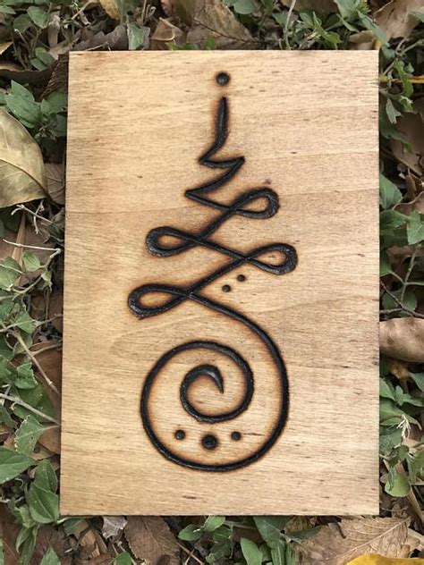 Wood burned unalome. In Buddhism, the spirals and twists of an unalome
