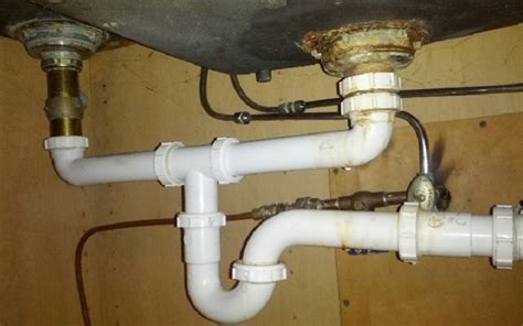 Enlist a plumber to fix broken water pipes in a wall if the drywall and floor under a sink are perpetually damp or wet. Replacing Kitchen Sink Pipes - Super Brothers Repipe