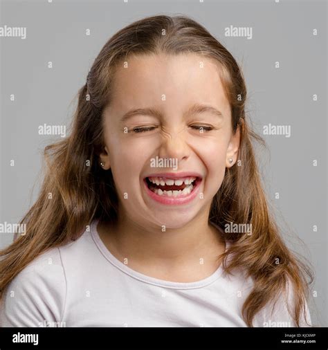 Portrait Of A Little Girl With A Laughing Expression Stock Photo Alamy