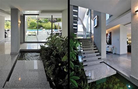 Indoor Water Garden At Foot Of Floating Marble Staircase
