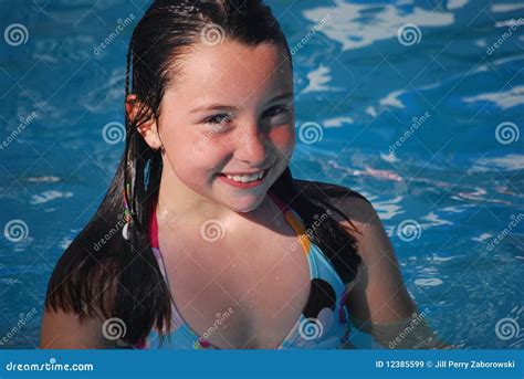 Girl Swimming In The River With Inflatable Crocodile Royalty Free Stock
