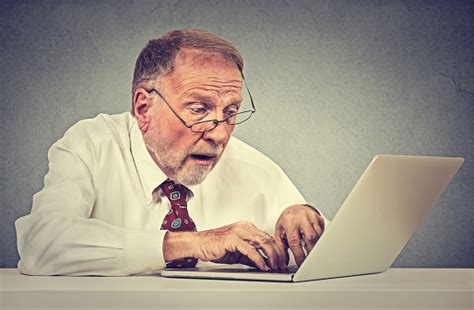 Confused Surprised Senior Man Using Pc Laptop Computer Stock Photo