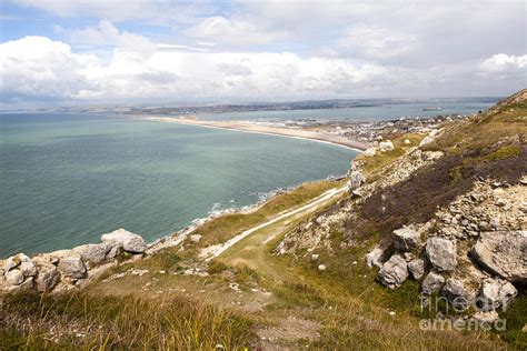 Chesil Beach With Weymouth Harbour Beyond Isle Of Portland Dorset