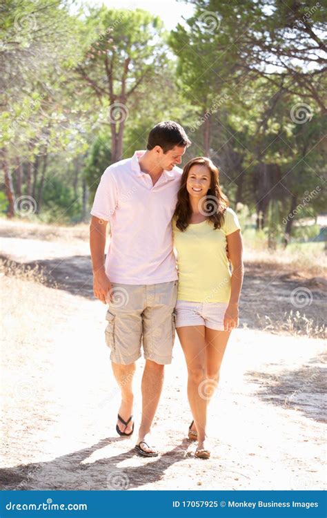 Young Couple Holding Hands Walkingwalk In Park Royalty Free Stock