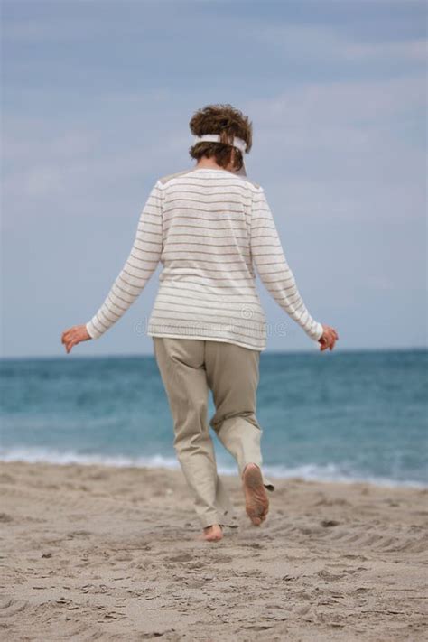 Senior Woman Enjoying The Breeze At The Beach Stock Image Image Of People Rest
