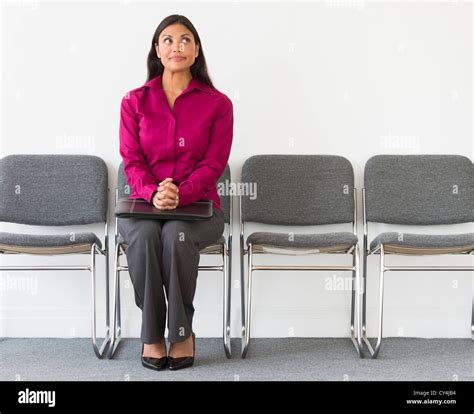 Usa New Jersey Jersey City Woman Sitting In Waiting Room Stock Photo