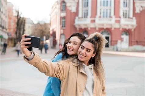 Free Photo Stylish Teenagers Taking A Selfie Outdoors