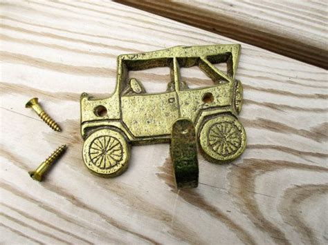 Vintage Brass Car Coat Hook | Etsy | Coat hooks, Vintage brass, Brass