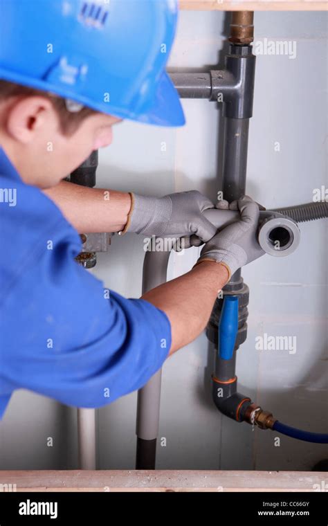 Plumber Installing Plastic Domestic Water Pipes Stock Photo Alamy