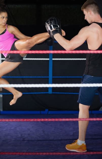 Premium Photo Female Boxer Practicing An Air Kick