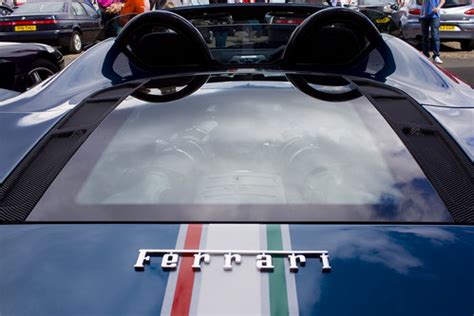 They don't just cover the four circular lights but adopt the entire shape of the tail. ferrari f430 scuderia spider 16m engine cover | Graeme Maclean | Flickr