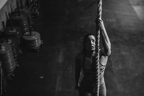 Active Fit Mixed Race Woman Recovering After Hard Ropes Workout In