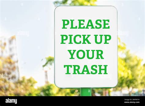 Signboard With Text Please Pick Up Your Trash Outdoors Stock Photo Alamy