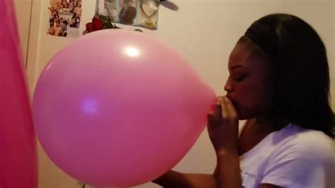 girl blowing up pink balloon youtube