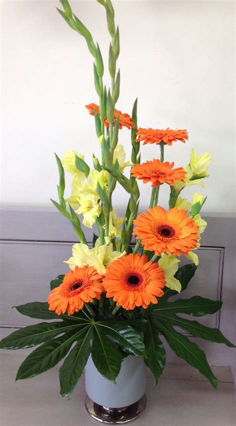 Ask if the church has standard arrangements that may be available for wedding use. Gladioli and orange gerberas arrangement for our corporate ...