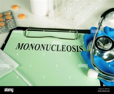 Mononucleosis Diagnosis On The Green Sheet And Gloves Stock Photo Alamy