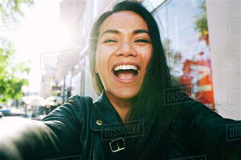 Asian Woman Smiling Outdoors Stock Photo Dissolve