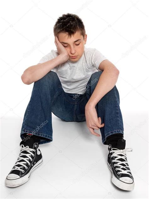 Sad Loney Depressed Or Listless Boy Sitting ⬇ Stock Photo Image By