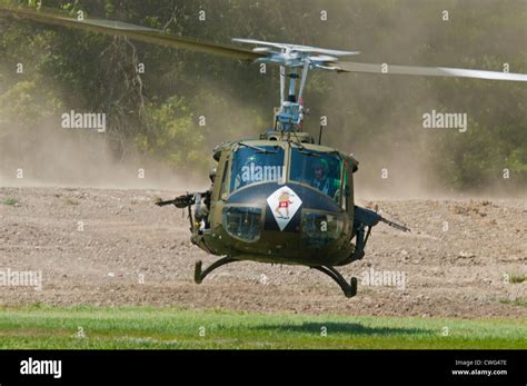 A Restored Vietnam Era Us Huey Helicopter Equipped With An M60 Mg