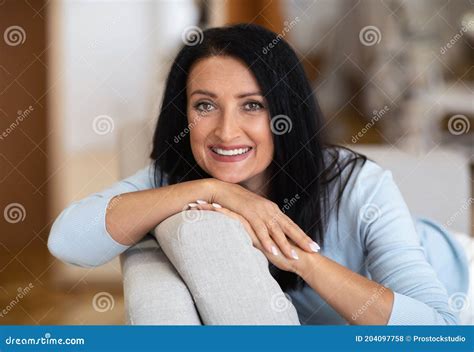 Closeup Portrait Of Lovely Middle Aged Brunette Woman Smiling Stock
