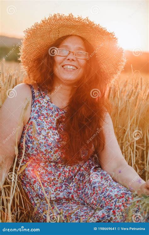beautiful mature woman in sundress at wheat field on sunset stock image image of happy woman