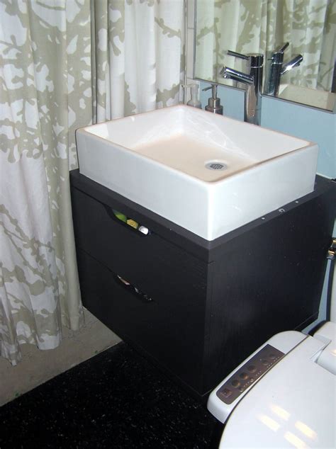 She used two ikea akurum wall cabinets for the vanity, and cut one in half to make room for the toilet. bathroom special: space saving wall mounted vanity - IKEA ...