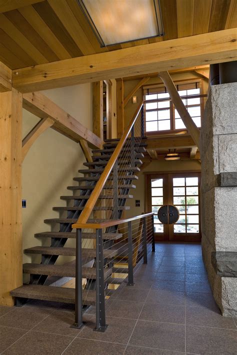 Your steps and railing system should fit the rest of your home aesthetically and safely. Rustic Stair Railing System with Custom Posts | Keuka Studios