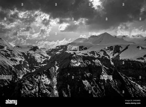 Picturesque View Of Greater Caucasus Mountains Against Stormy Skies