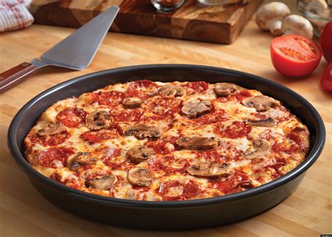 dominos introduces handmade pan pizza marches   pizza hut territory huffpost