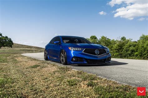 Electric Blue Acura Tlx Wearing A Blacked Out Mesh Grille —