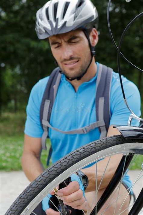 Portrait Smiling Male Cyclist Repairing Bike Stock Image Image Of