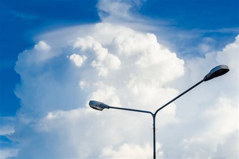 Electric Street Light Pole On Blue Vivid Sky In Day Light Stock Photo