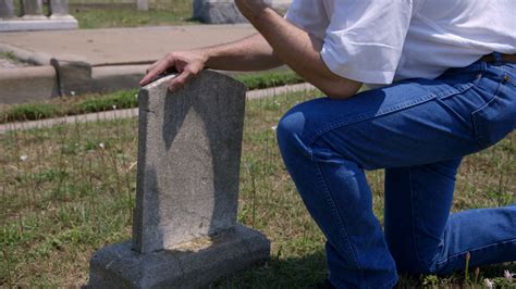 man grieving at a grave site Stock Video Footage - Storyblocks