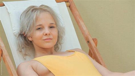 women pornstar blonde long hair katerina kozlova looking at viewer sitting deck chairs