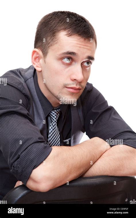 Portrait Of Young Caucasian Smart Business Man Sitting On Chair