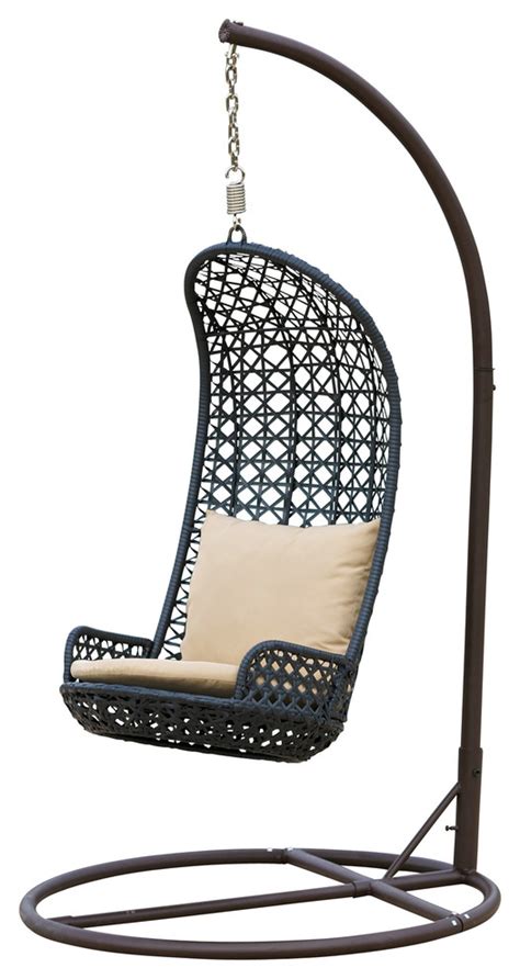 Suspend yourself within this cozy sheltered perch, complete with a tufted taupe cushion for the ultimate lounging experience. Brinkley Outdoor Brown Wicker Swinging Chair ...
