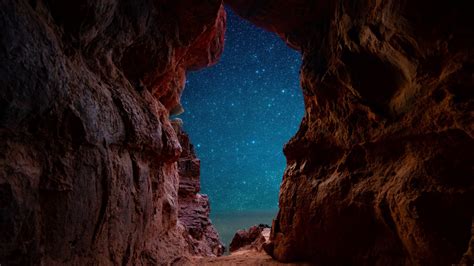 View Of Starry Night Through Beach Cave